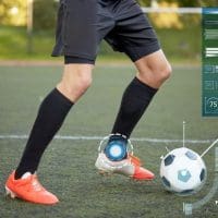 sport-technology-people-concept-soccer-player-playing-with-ball-football-field_380164-180879